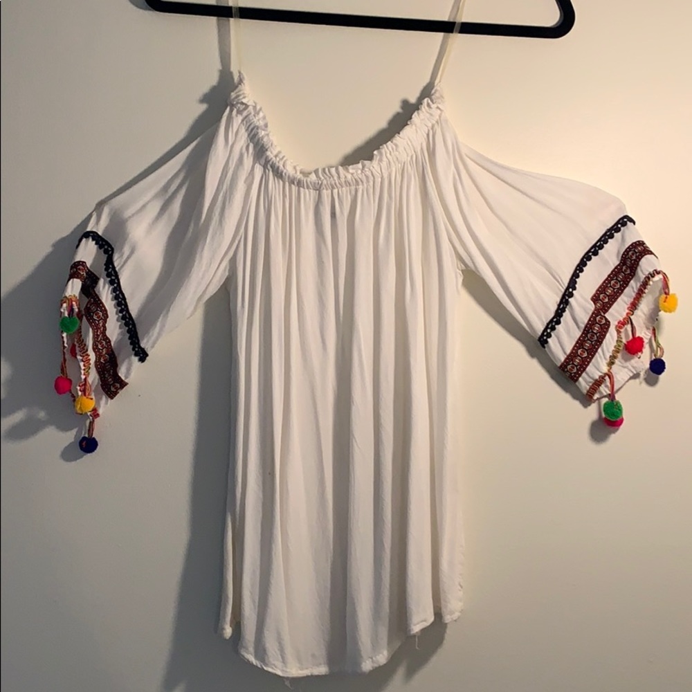 off shoulder white shirt with pom pom sleeves